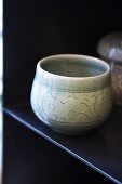 Oriental tea bowl on a shelf