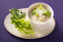 Parmesan dressing with lettuce leaves