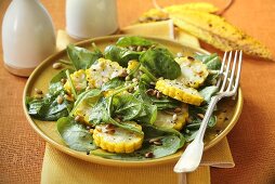 Spinach salad with sweetcorn and pine nuts
