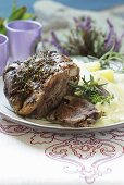 A leg of lamb with salted potatoes