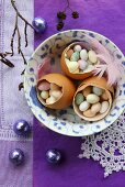 Three egg shells filled with sugar eggs