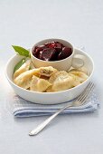 Pierogi (steamed dough parcels) filled with herring with a beetroot salad