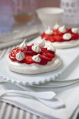 Meringue tarts with strawberries marinated in ginger syrup