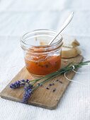Apricot and lavender jam in jar with spoon