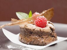 Chocolate soufflé with raspberries and caramel