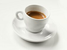Espresso in white cup and saucer
