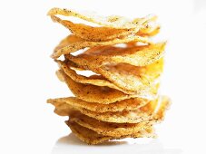 Spicy potato crisps, stacked