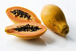 Papayas, whole and halved