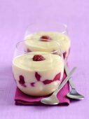 Coconut cream with raspberries in two glasses