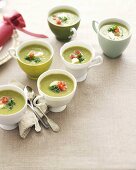 Cold green asparagus soup in cups