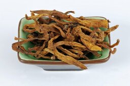 Dried lily buds in dish