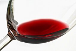 A little red wine in a glass (close-up)