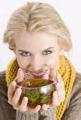 Blond woman drinking herbal tea