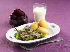 Boiled potatoes with grain sauce and beetroot