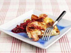 Potato gratin with bacon and cranberry compote