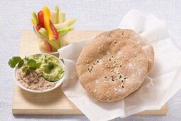 Wholemeal pita bread with guacamole, tuna dip & raw vegetables