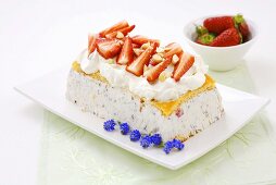 Cassata with whipped cream and fresh strawberries