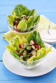 Asparagus salad with surimi and capers on a bed of lettuce