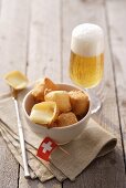 Fried cheese cubes (Appenzeller) with beer