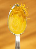 Cream of pumpkin soup in spoon