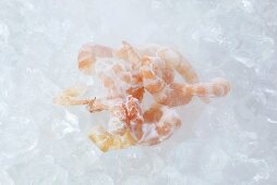 Frozen, peeled prawns on ice