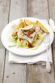 Steamed cod with chilli butter on leeks, potato wedges