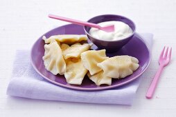Pasta parcels with cottage cheese filling, raisins, cream, Poland