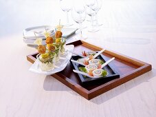 Fried chicken appetisers and sole rolls with spinach