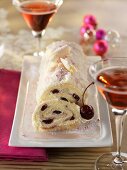 Festive sponge roll with cherry filling, with dessert wine