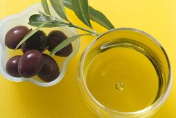 Olive oil and olives in small dish