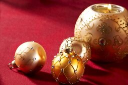 Christmas baubles and a ball shaped candle holder