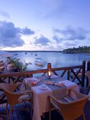 Laid table on terrace on Mauritius at twilight