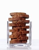 Slices of rye bread in a square glass
