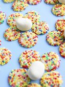 White gems (white chocolate buttons with sprinkles) forming flowers