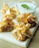 Pastry purses with vegetable filling & minted yoghurt sauce