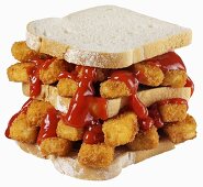 Double-decker fish finger sandwich with ketchup