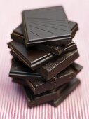 Pieces of organic dark chocolate, stacked