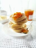 Crumpets with butter and apricot jam