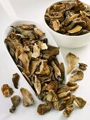 Dried ceps in scoop and small bowl