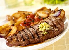 Grilled beef steak with roast potatoes