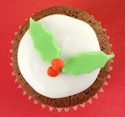 Chocolate cupcake with holly leaf decoration