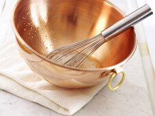 Egg white in a copper bowl