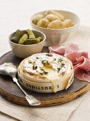 Baked cheese with gherkins and potatoes