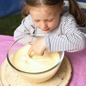 Little girl tasting home-made ice cream