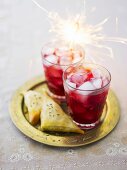 Pomegranate drinks with samosas and sparkler