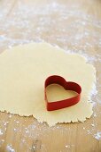 Biscuit dough and a heart-shaped cutter