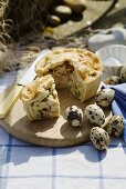Chicken and ham pie and quails' eggs for a picnic