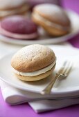 A whoopie pie and a dessert fork (close-up)