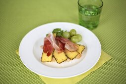 An open ham and cheese sandwich
