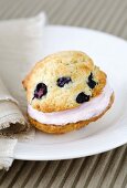 Whoopie Pie with blueberries on a plate with a cloth napkin